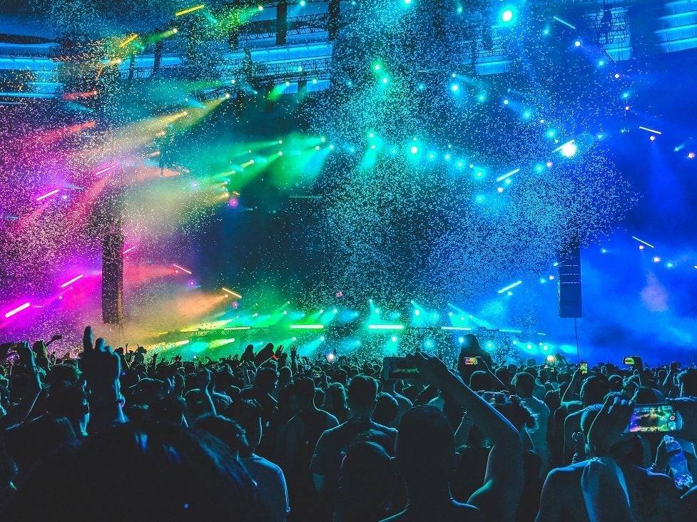 Crowd watching a colorful stage light show
