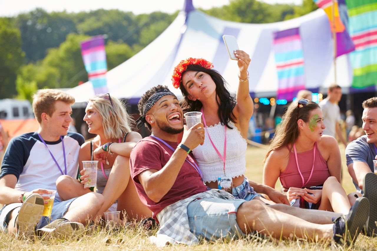 Group of friends enjoying music together at a festival